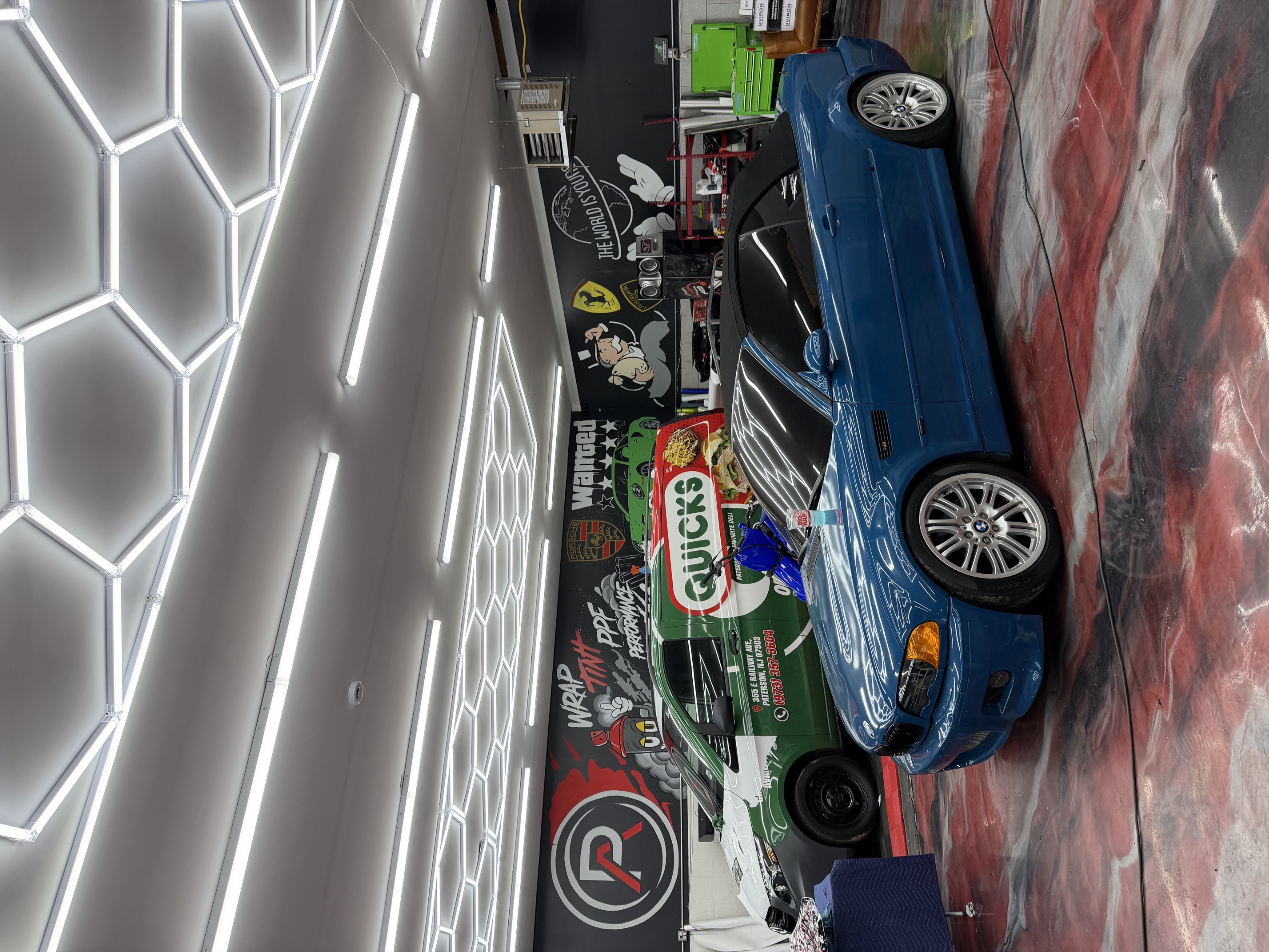 Blue BMW in the Perfect Autowerks service bay