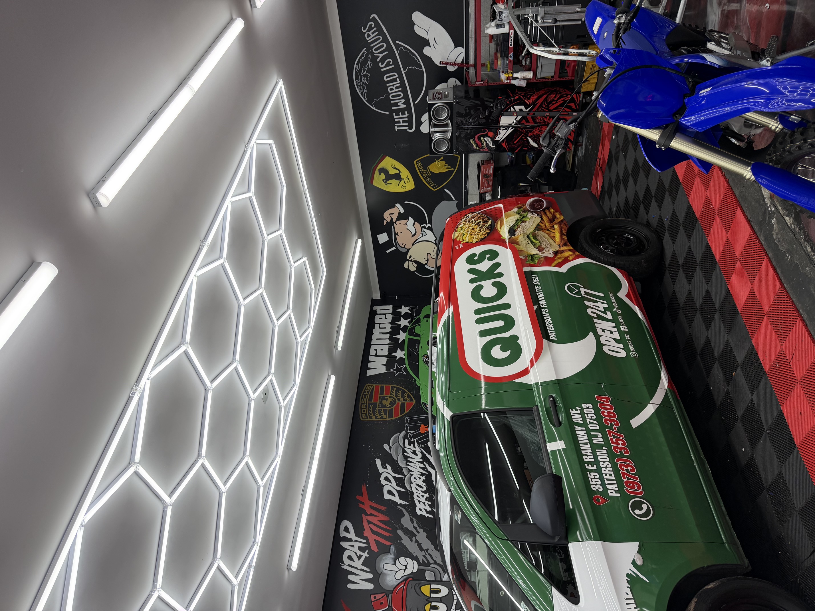 Commercial wrap vehicle under shop lighting