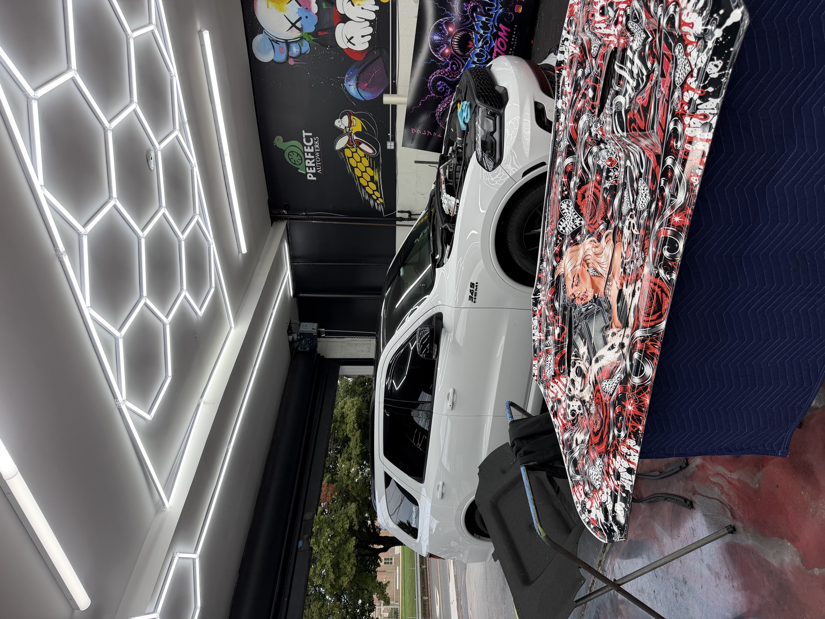 Custom wrapped hood panel inside Perfect Autowerks